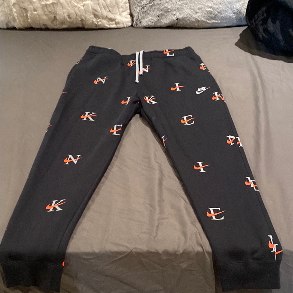 Nike Black Joggers with Orange Accents